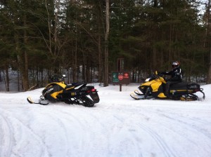 Scott Ballard {on the sled} and Mike Stewart on the last ride of the season, April 15, 2013! They are at the interestion of the CCC Road and the loop trail.The snow looks good there! They were out locking the gates that night, thank you!